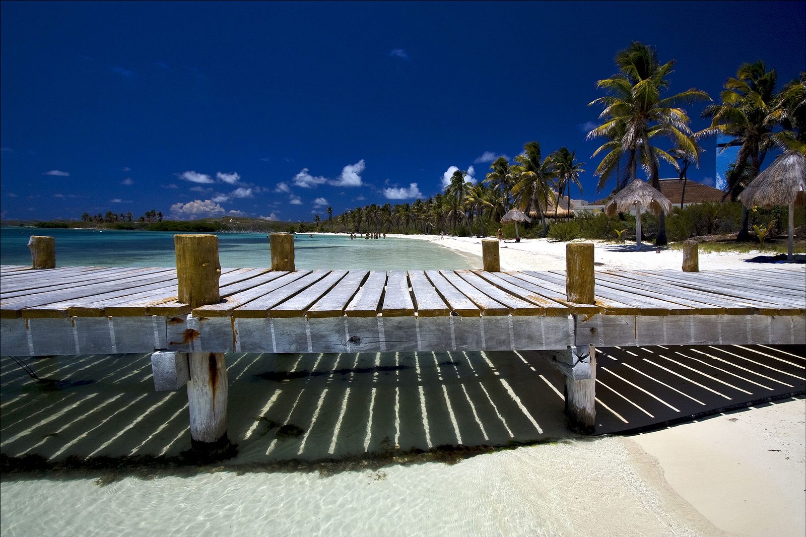 Isla Contoy pier over crystal clear water